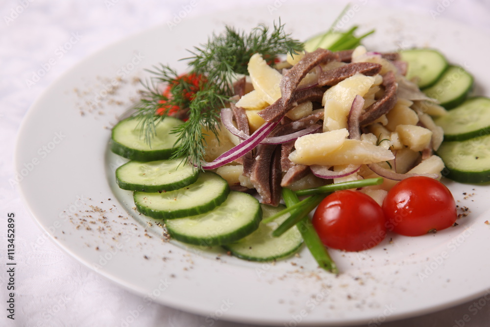 meat with potatoes and cucumber