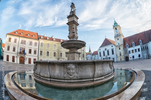 old fountain in the Main Square (Hlavne namestie) in Bratislava in the early morning photo