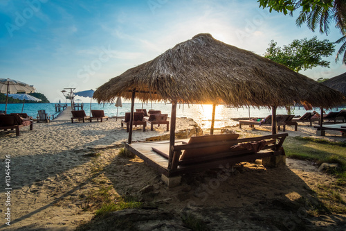 Relax pavilion on the sunset tropical beach © Pattanasak Suksri