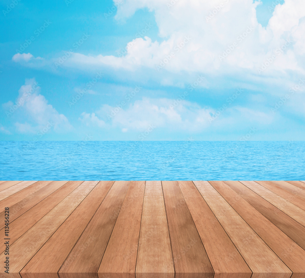 Wood table top on blue sea and sky background

