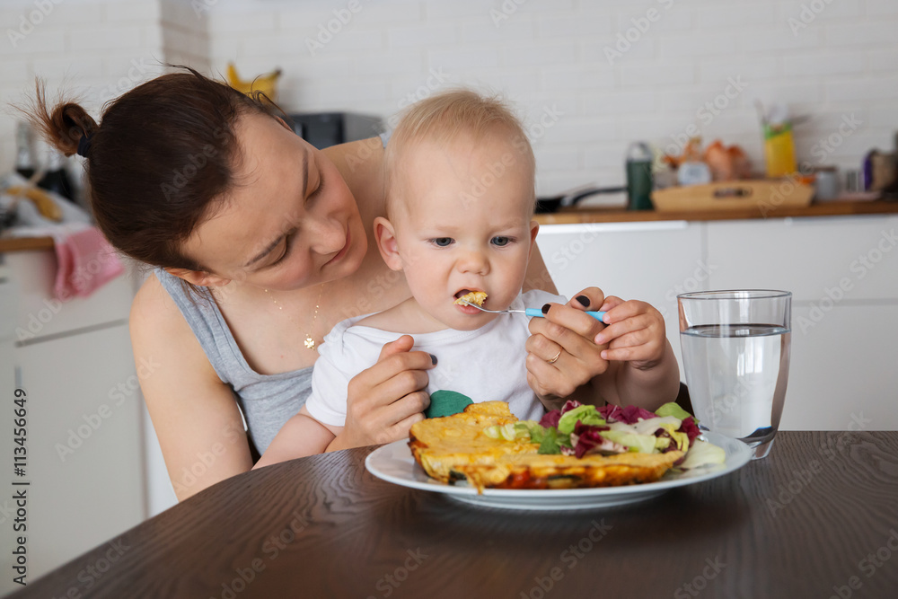 Mother and child eating together and have fun Mother and child eating together and have fun