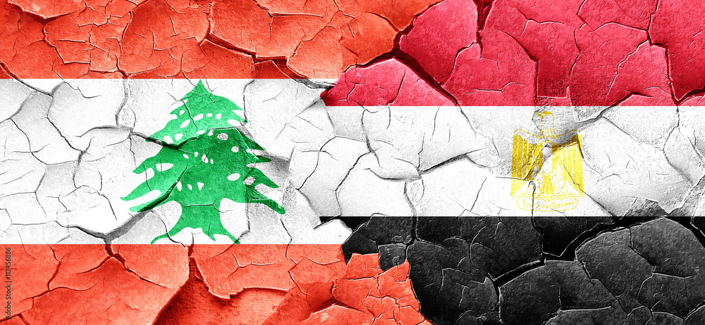 Lebanon flag with egypt flag on a grunge cracked wall