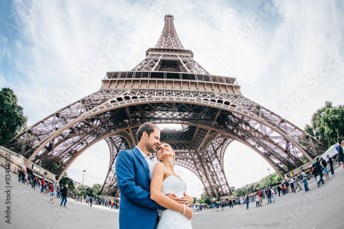 incredible views of the newlyweds, under the Eiffel Tower, fisheye © xan844