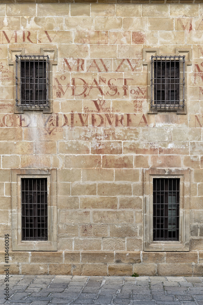 Ancient facade with symmetrical windows, Baeza, Spain