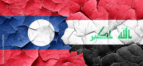 Laos flag with Iraq flag on a grunge cracked wall