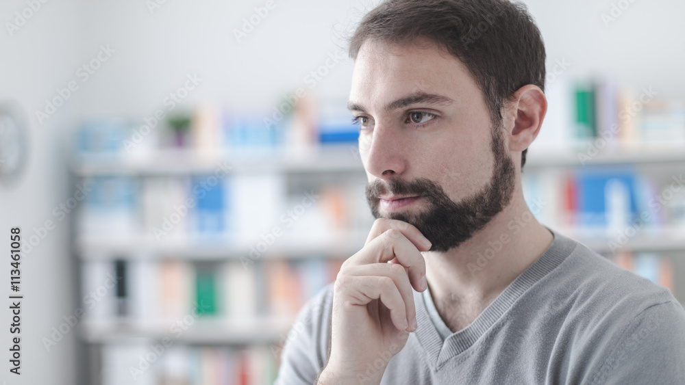 Confident man with hand on chin Confident man with hand on chin
