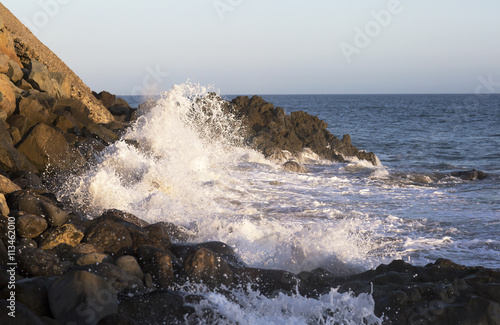 The waves of the Pacific ocean, the beach landscape. The ocean and waves during strong winds in United States, California. Waves breaking on the rocks. Beach landscape in Malibu. 