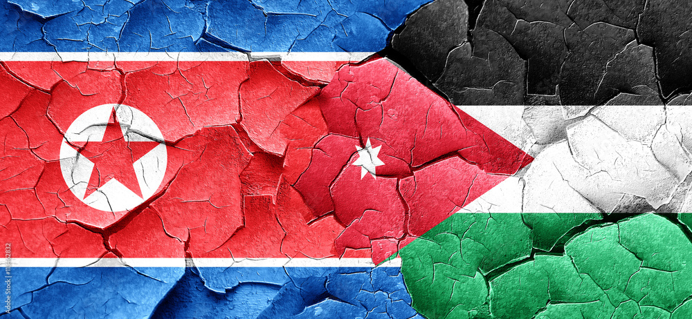 North Korea flag with Jordan flag on a grunge cracked wall North Korea flag with Jordan flag on a grunge cracked wall
