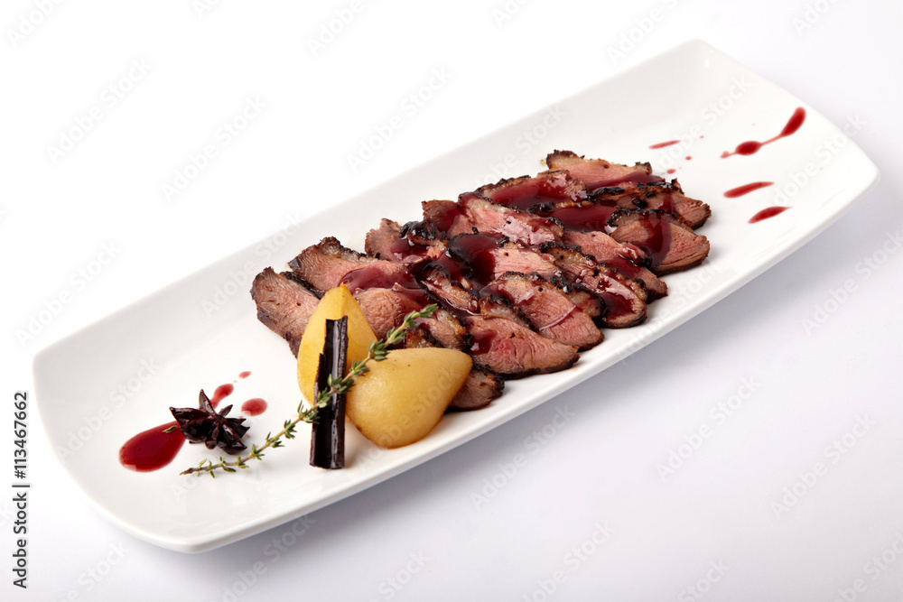 Grilled meat with pear on a white background Grilled meat with pear on a white background