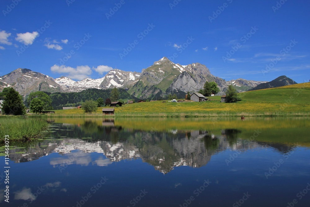 Alpstein range mirroring in lake Schwendisee Alpstein range mirroring in lake Schwendisee