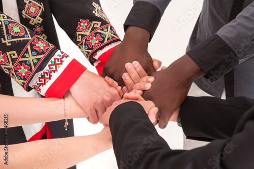 Photography People of different nationalities and religions hold hands