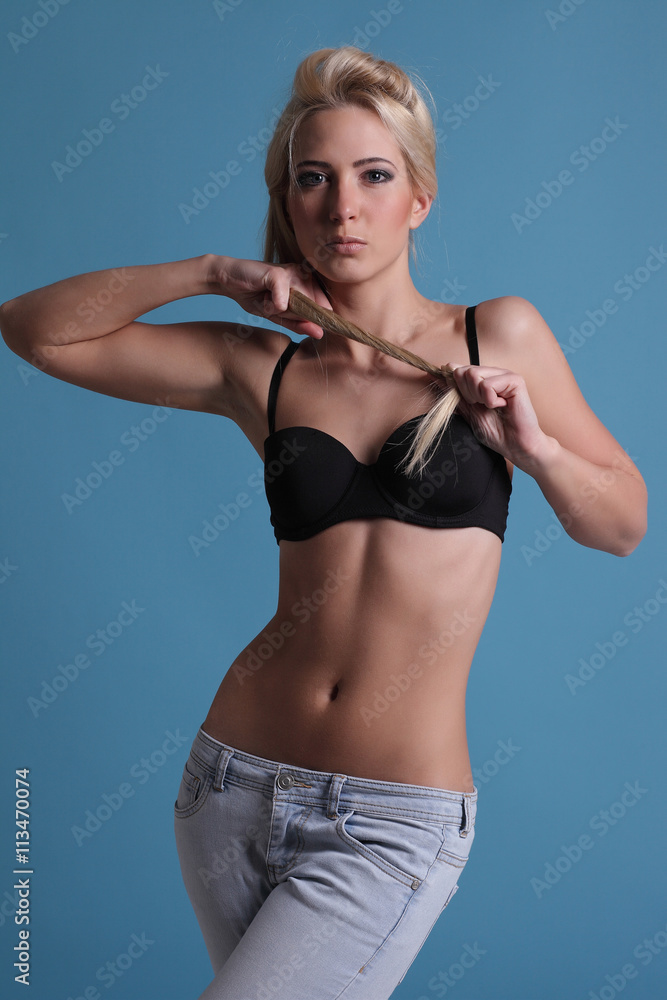 girl in black bra and blue jeans Stock Photo