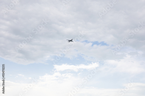 plane crossing a cloud vignette