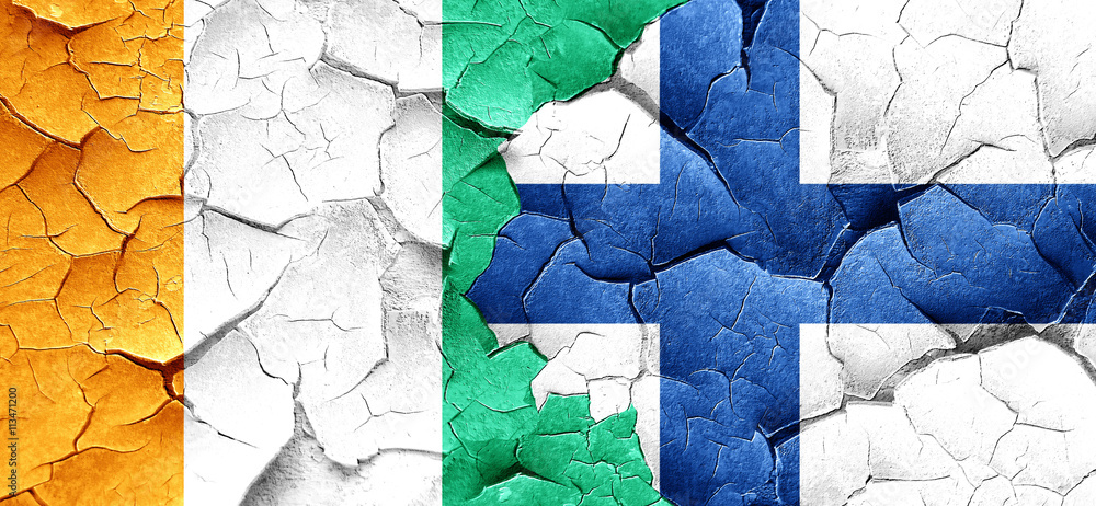 Ivory coast flag with Finland flag on a grunge cracked wall