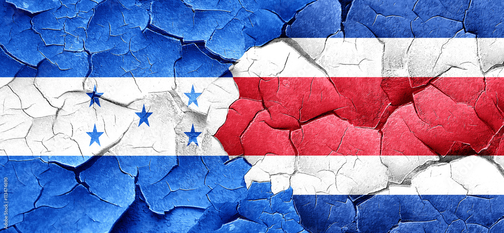 Honduras flag with Costa Rica flag on a grunge cracked wall Honduras flag with Costa Rica flag on a grunge cracked wall