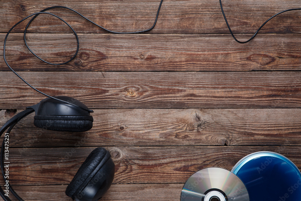 top view of music cd player equipment on wooden desk top view of music cd player equipment on wooden desk
