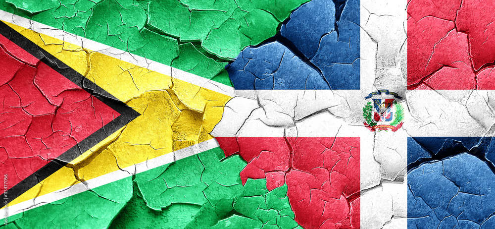 Guyana flag with Dominican Republic flag on a grunge cracked wal