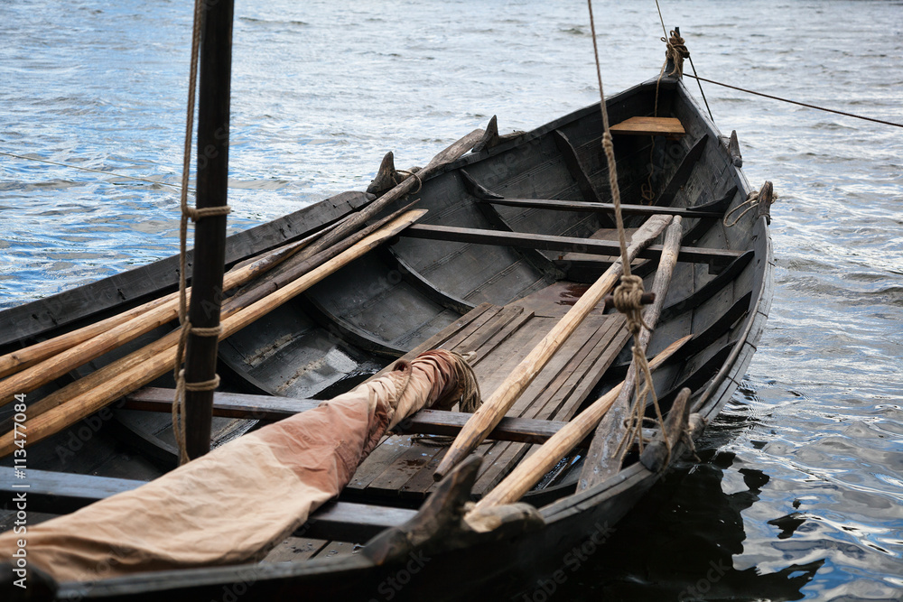 old Viking boat. old wooden boat with oars