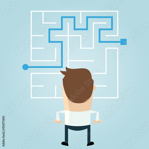 businessman standing in front of a maze with a solution to success