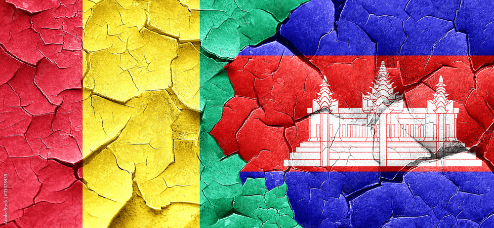 Guinea flag with Cambodia flag on a grunge cracked wall