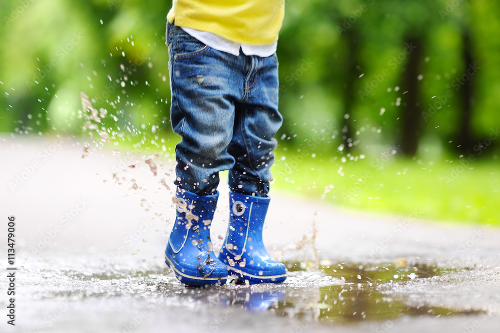 Toddler jumping in pool of water Toddler jumping in pool of water