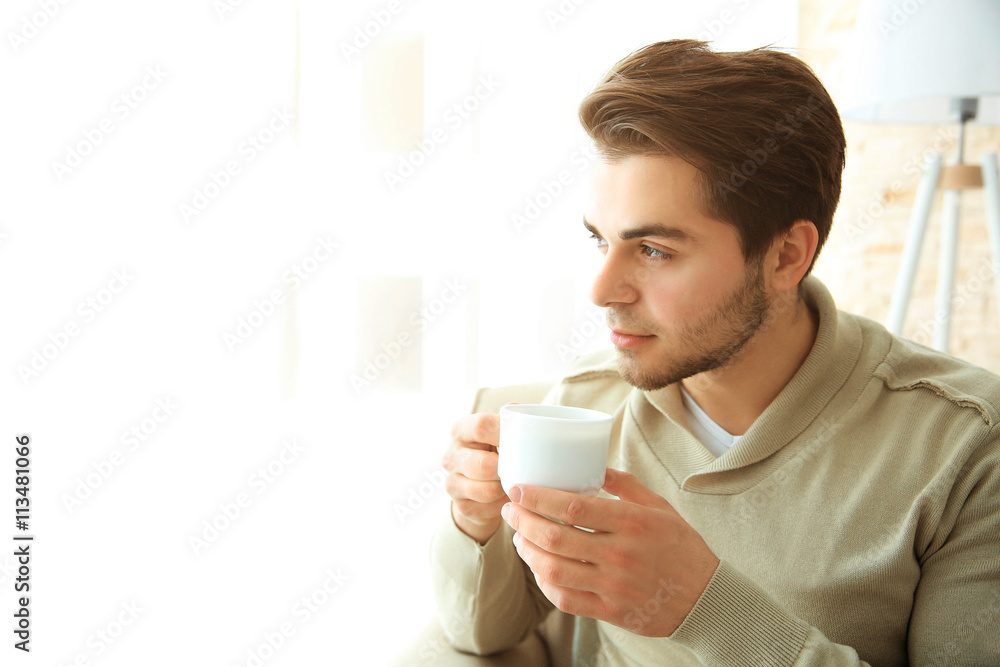 Handsome man drinking coffee in the morning Handsome man drinking coffee in the morning