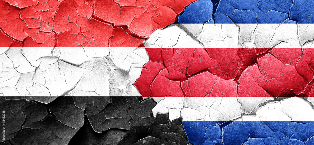 Yemen flag with Costa Rica flag on a grunge cracked wall