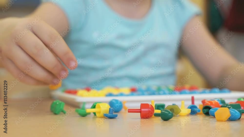 Child plays the intellectual educational game Child plays the intellectual educational game