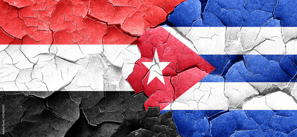Yemen flag with cuba flag on a grunge cracked wall Yemen flag with cuba flag on a grunge cracked wall