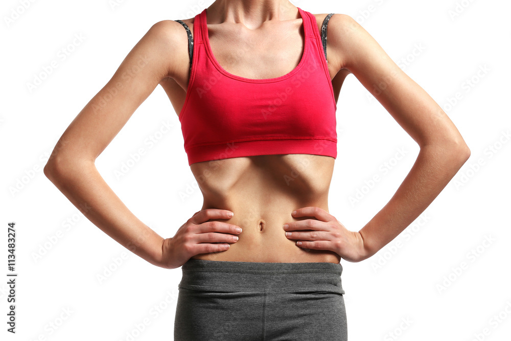 Belly of young woman with anorexia on white background Belly of young woman with anorexia on white background