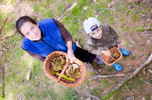 Mother and son shows mushrooms