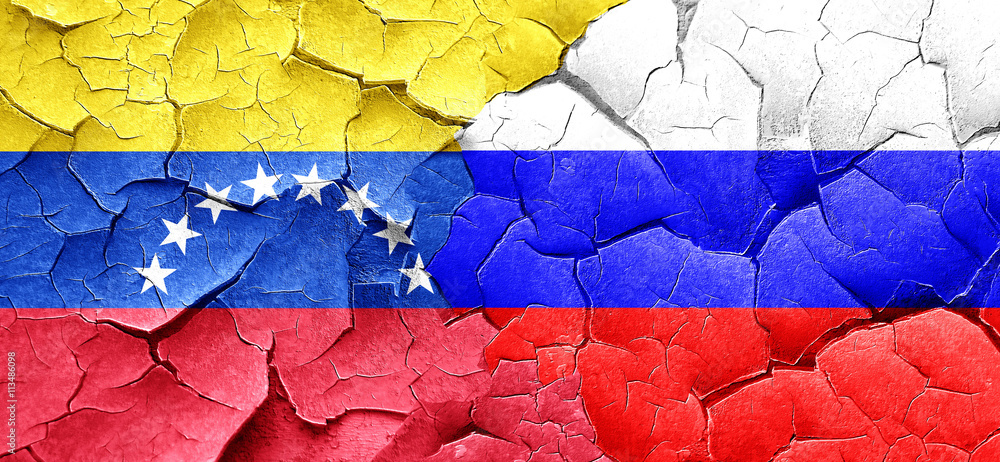Venezuela flag with Russia flag on a grunge cracked wall