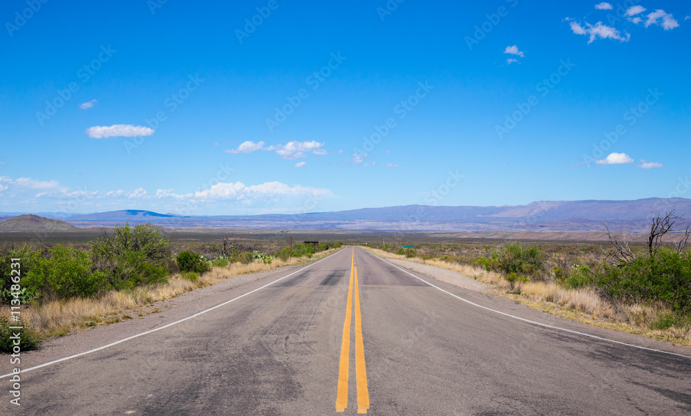Beautiful cinematic view of the road under the blue cloudless sky in America