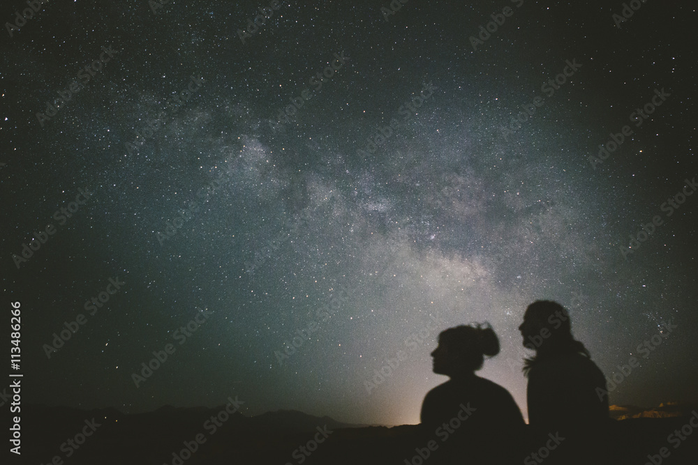 Silhouette of a friends looking at stars during night Silhouette of a friends looking at stars during night