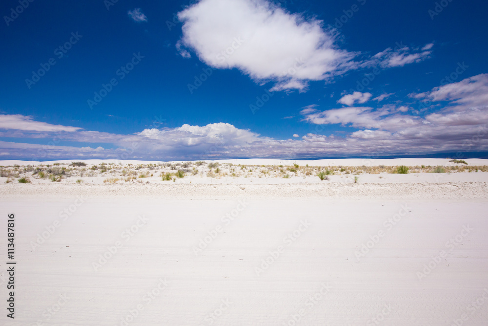 Beautiful cinematic deserted nature view under the blue cloudless sky in America. White sands.