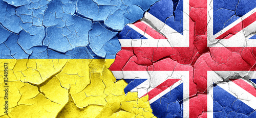 Ukraine flag with Great Britain flag on a grunge cracked wall