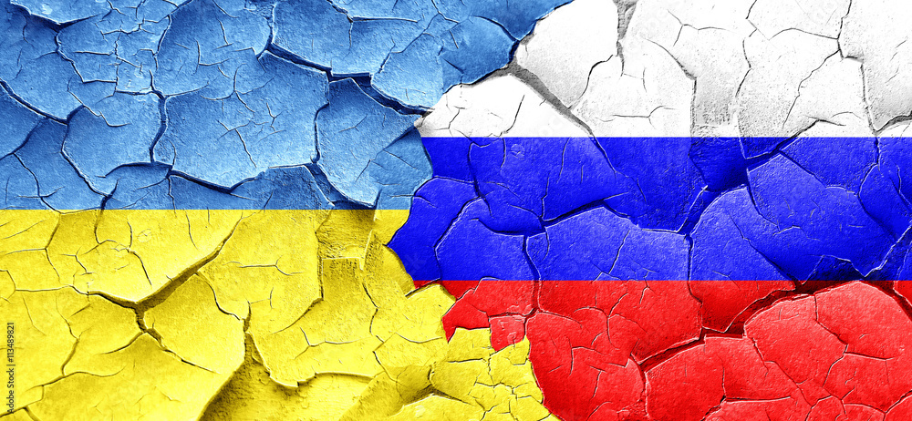 Ukraine flag with Russia flag on a grunge cracked wall