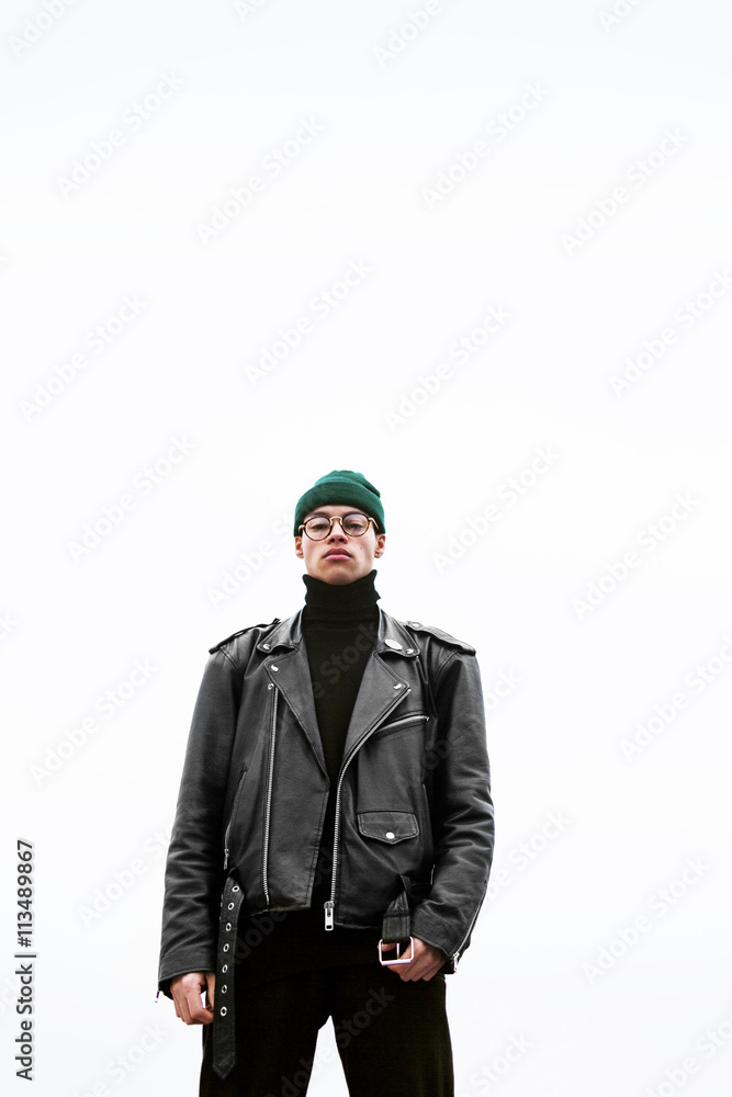 Portrait of confident young man standing against sky in foggy weather Portrait of confident young man standing against sky in foggy weather