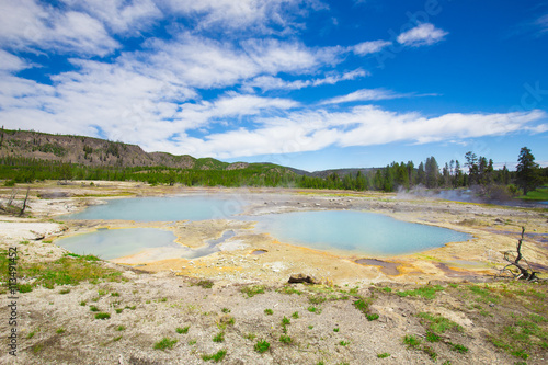 Beautiful cinematic view of nature landscape in the American West under the blue cloudy sky. Geyser.