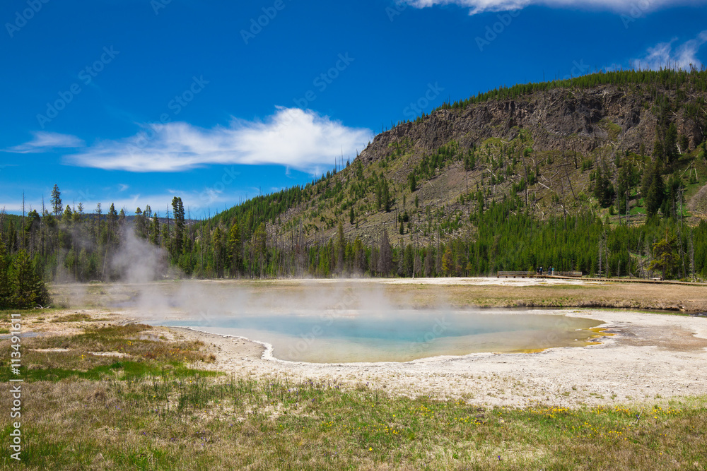 Beautiful cinematic view of nature landscape in the American West under the blue cloudy sky. Geyser. Beautiful cinematic view of nature landscape in the American West under the blue cloudy sky. Geyser.