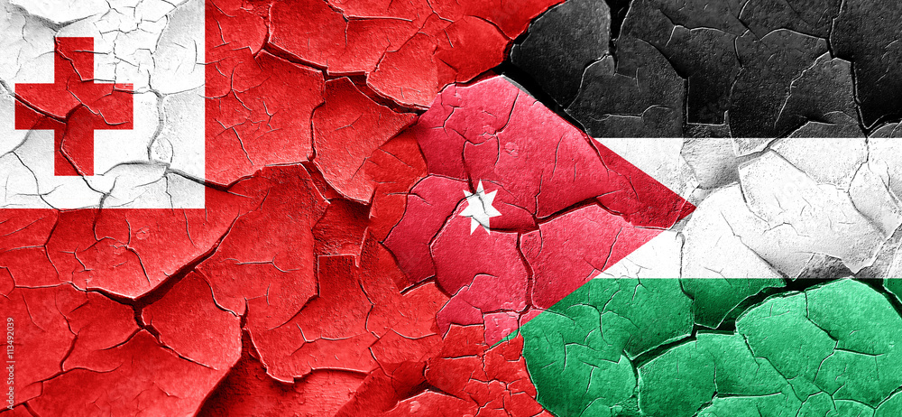 Tonga flag with Jordan flag on a grunge cracked wall Tonga flag with Jordan flag on a grunge cracked wall