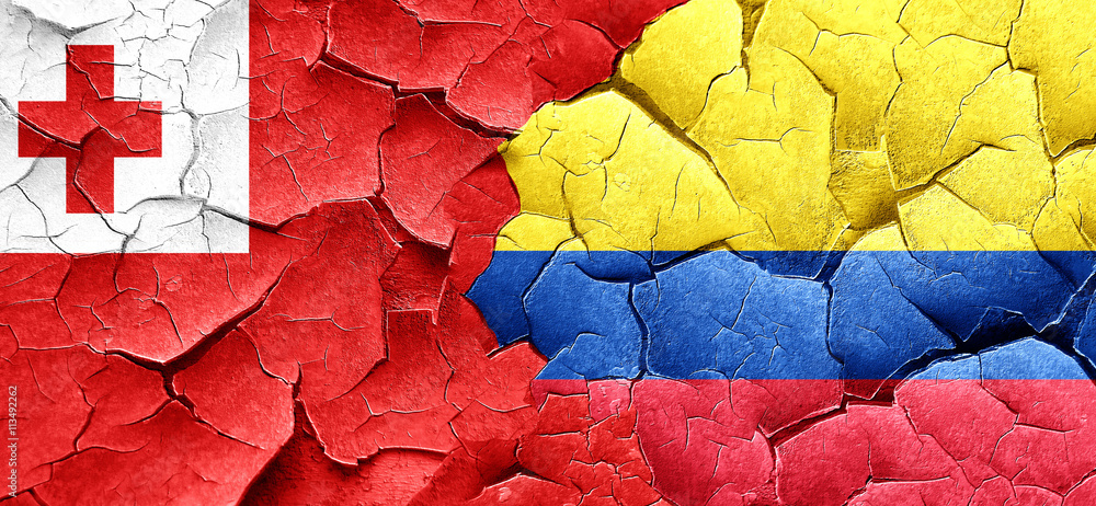 Tonga flag with Colombia flag on a grunge cracked wall Tonga flag with Colombia flag on a grunge cracked wall