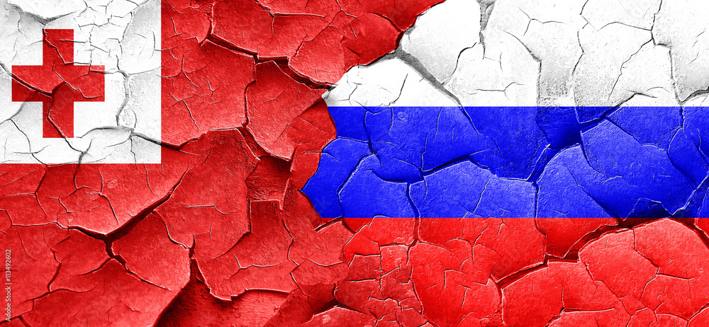 Tonga flag with Russia flag on a grunge cracked wall Tonga flag with Russia flag on a grunge cracked wall