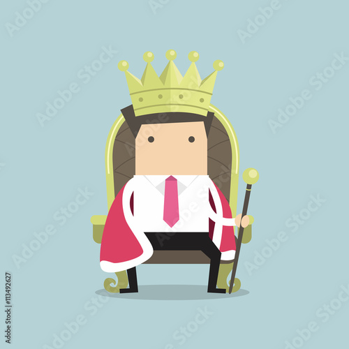 Businessman sitting on the throne with the crown like a king