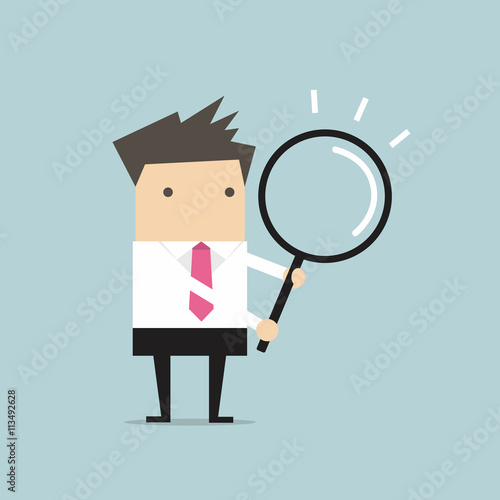 Businessman with a magnifying glass