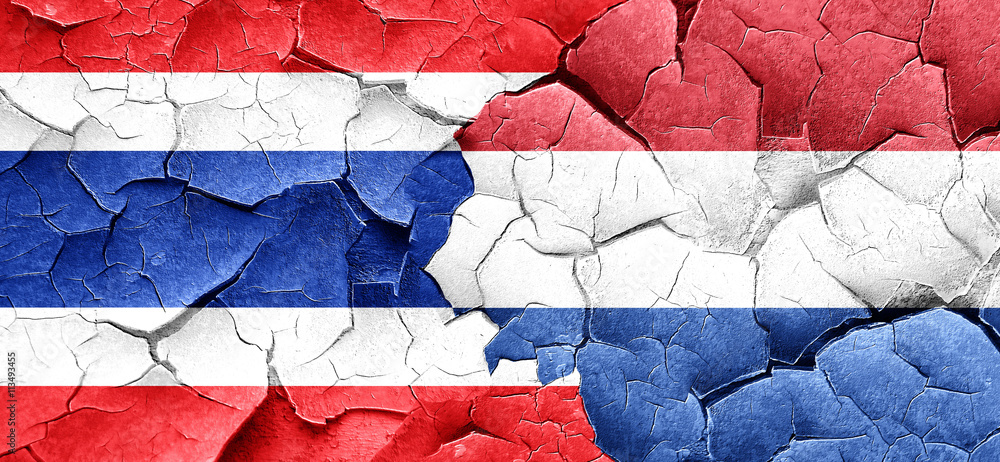 Thailand flag with Netherlands flag on a grunge cracked wall