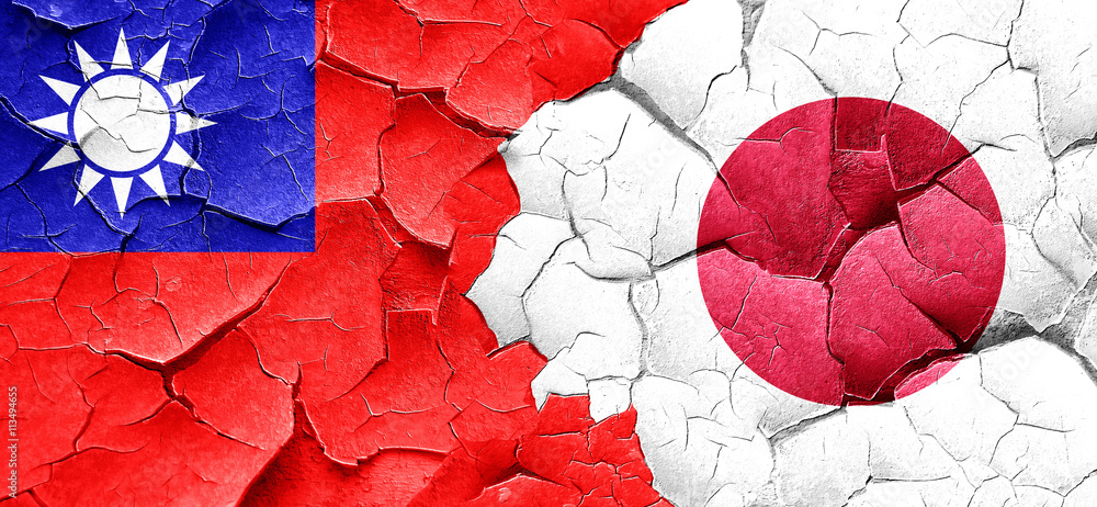 Taiwan flag with Japan flag on a grunge cracked wall Taiwan flag with Japan flag on a grunge cracked wall