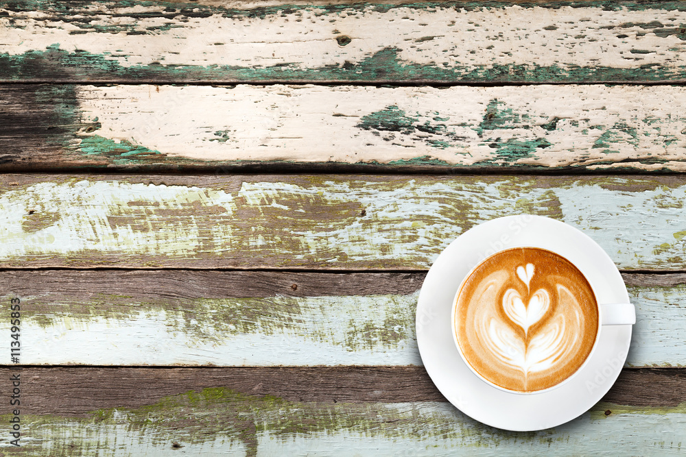 Top view latte art coffee on old wood background Top view latte art coffee on old wood background