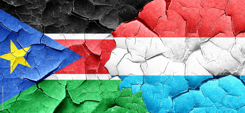 south sudan flag with Luxembourg flag on a grunge cracked wall