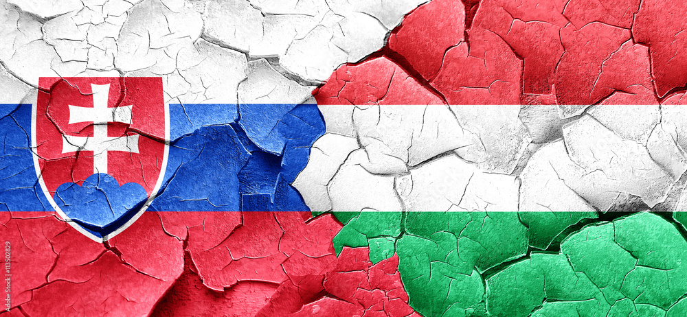 Slovakia flag with Hungary flag on a grunge cracked wall
